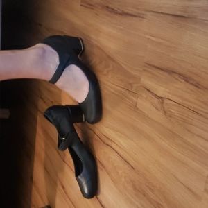 Black Mary Jane Sudini shoes with velcro strap and metal detail on heel, size 10